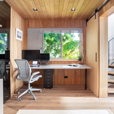 cozy study room and office finished in victorian ash timber paneling with a view to green aspects of Mosman