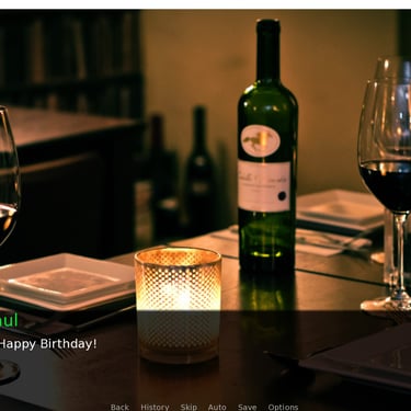 An elegant candle-lit table in a restaurant featuring a bottle of red wine