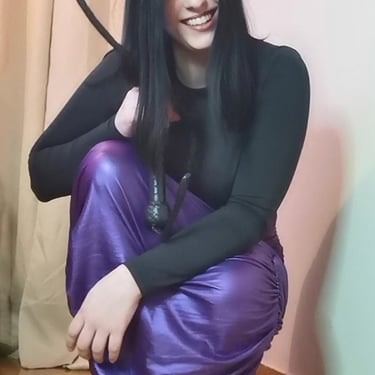 Ecstatic FemDomme Mistress Nereid holding Her bullwhip