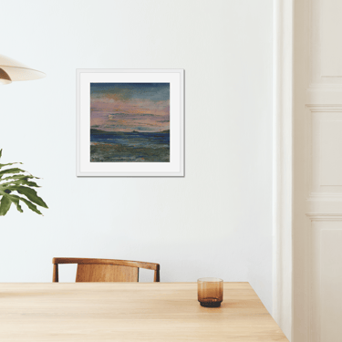 a table with a vase and a vase with a plant in it