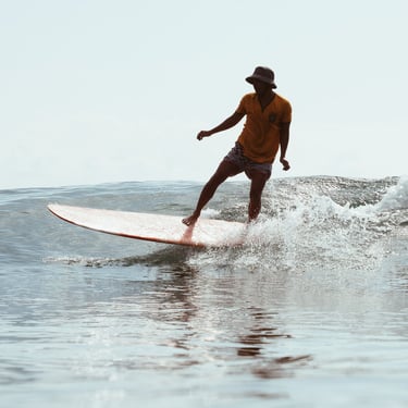 Reki Ucup's student surfing in Batukaras