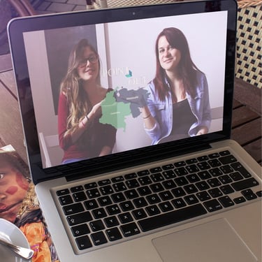 A laptop computer screen showing a picture of two women