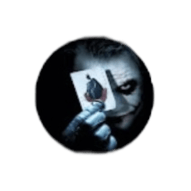 The Joker from The Dark Knight holding a joker playing card in front of his face on a black background.