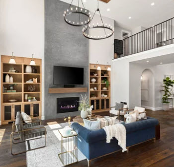 a living room with a large couch and a fireplace