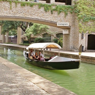 Tour boat on canal- Hilton Homewood Suites Hotel.