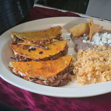 birria with beans and rice