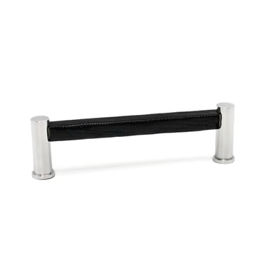 Photography case study featuring a cabinet pull with a leather wrap and silver metal finish.