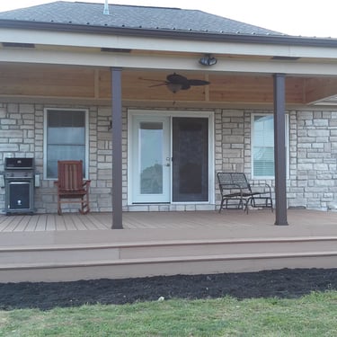Covered composite deck with continuous steps and metal roof