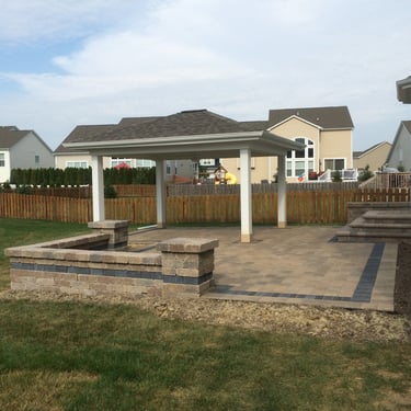 Paver patio with seat wall and entertainment pavilion