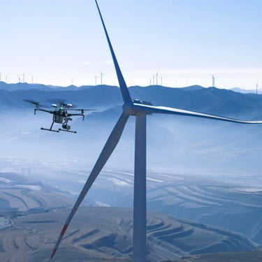a drone flying over a wind turbine