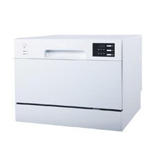 A compact white countertop dishwasher features a simple control panel on the right and a recessed handle for easy access.