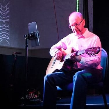 David Fletcher performing live with AJ Acoustic Duo 2025