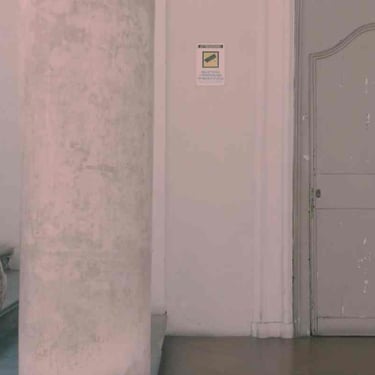 Alles Anders poetical digital storytelling by Tina Bikic — weathered door beside marble column in interior