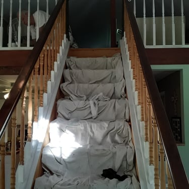 Drop clothes covering interior stairway