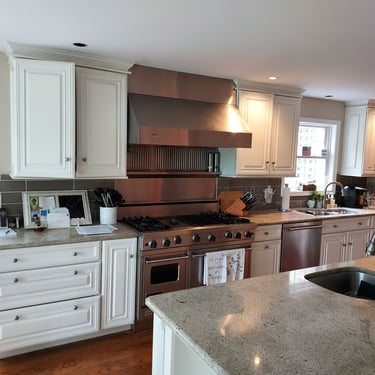 a kitchen with counter top and cabinets