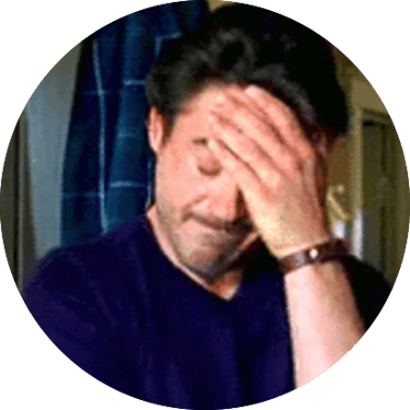 A man placing his hand to his head, displaying frustration.