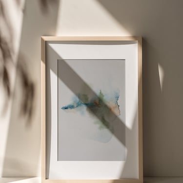 Light wood framed minimalist watercolor painting by Sweet Ruby Moon in soft natural light