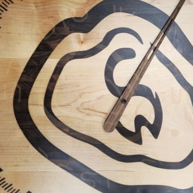 24-hour wood inlay clock in shape of logo