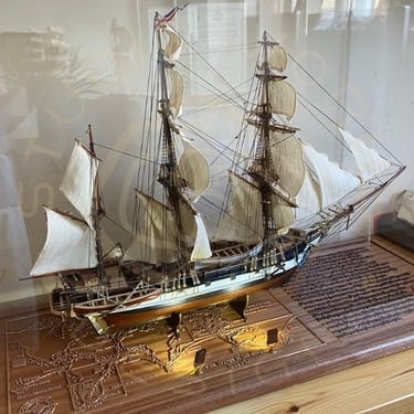 Display base for a model ship display showing integrated lighting