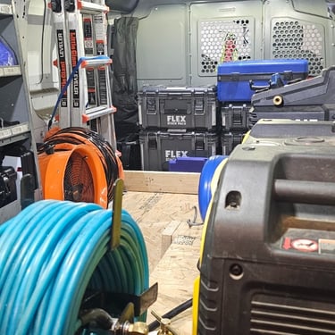 photo of the back of a subsurface leak detection van showing equipment 