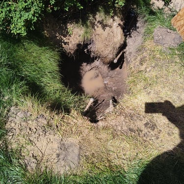 pipe capped on both ends where a leak was in a hole