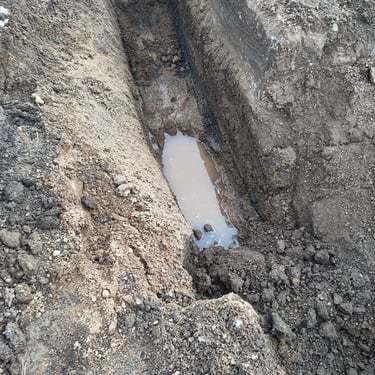 water in the excavation of a leak located in Denver Colorado