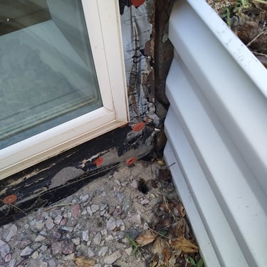 window with flashing showing in window well 