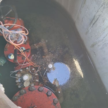 water flooded into a utility vault with a commercial master meter