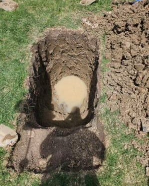 water in hole while diffing to find leak in grass