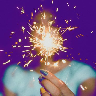 person carrying a bright beautiful light surrounded by purple sky