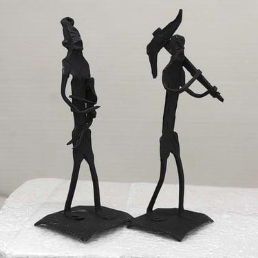"Handmade iron sculpture of tribal farmer with plough, wife holding child-for worldwide trade"