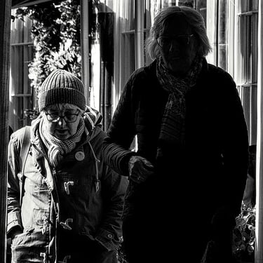 Two women, one in shadow, on in the light, on Victoria Terrace, Edinburgh