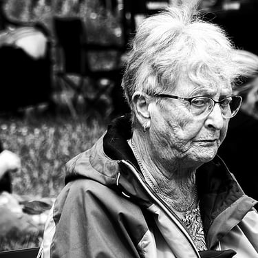 A woman gives a sideways disapproving glance. Harrison Park, Edinburgh