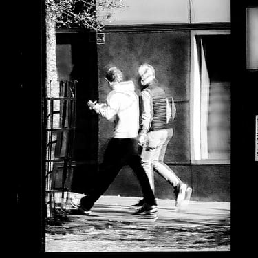 Two men walking, reflected in a window at High Riggs, Edinburgh