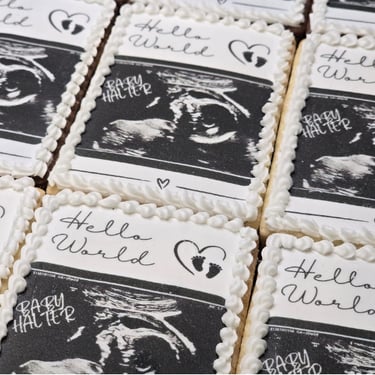 Handcrafted baby birth announcement cookies decorated with personalized details, perfect for celebrating a newborn