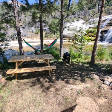 campsite next to waterfall