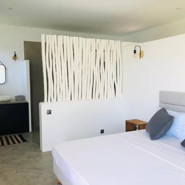 a bed with pillows and pillows on a bed