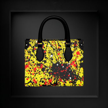 Luxury leather handbag by Vymoyre featuring a vibrant yellow, red, and black paint splatter design.