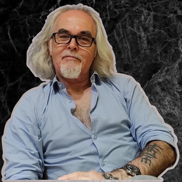 a man with a beard and glasses on a table