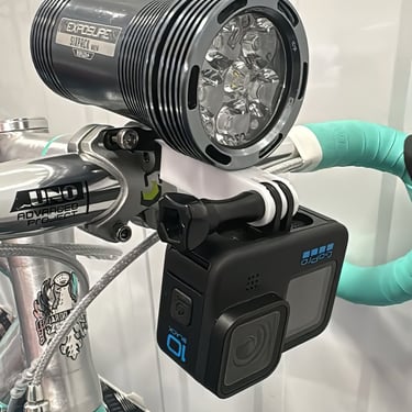 combo mount on a green bike with exposure light and Gopro camera installed