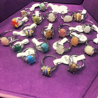 a collection of rings with a variety of colored stones