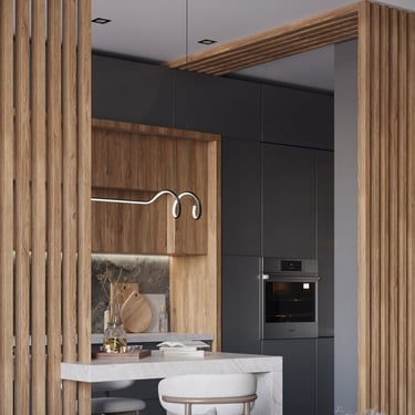Modern kitchen with marble countertop, wood cabinets, cushioned stools, and slatted wooden partition.
