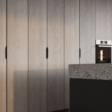 3D rendering of a modern kitchen with tall gray wood cabinets, black handles, built-in oven, and textured stone island.