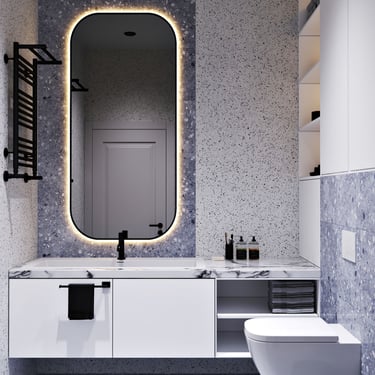 Modern bathroom with oval mirror, marble vanity, terrazzo walls and floor, wall-mounted toilet, and open shelves.