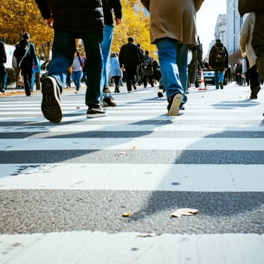 Urban crowd crossing street, symbolizing emergency preparedness and survival planning in busy cities