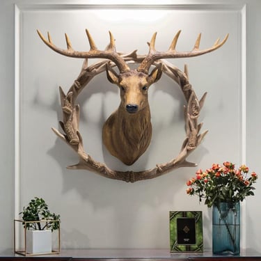 a deer head mounted on a wall in a room