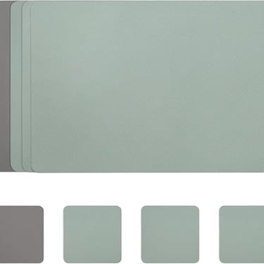 Set of sage green and grey faux leather placemats with a textured finish for dining table protection.