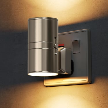 Modern brushed metal plug-in wall light with an adjustable cylinder lampshade casting warm LED light.