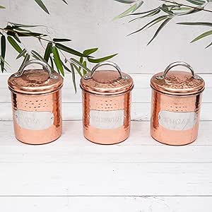 three copper canisters with a bamboo leaf and bamboo leaf