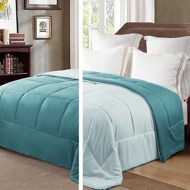 a bed with a blue comforter and a white bed
